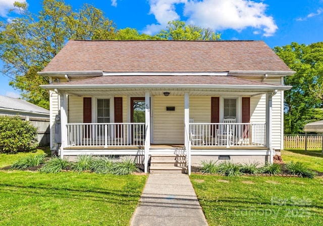 406 S Gaston St, Dallas, NC 28034 - bungalow-style house with fence, a shingled roof, crawl space, covered porch, and a front yard