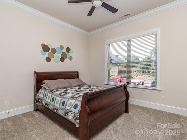 bedroom featuring visible vents, crown molding, baseboards, and light carpet