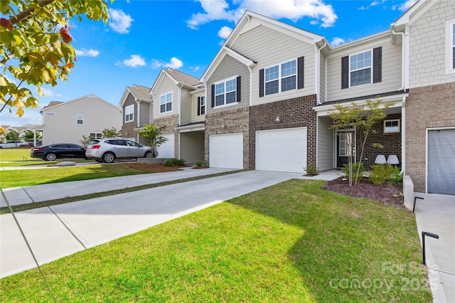 7004 Everly Commons Ln, Tega Cay, SC 29708 - townhome / multi-family property with driveway, brick siding, a residential view, and a garage