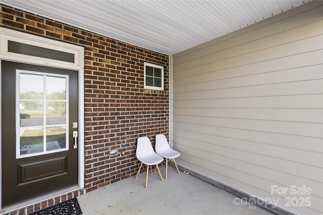 7004 Everly Commons Ln, Tega Cay, SC 29708 - view of exterior entry featuring brick siding