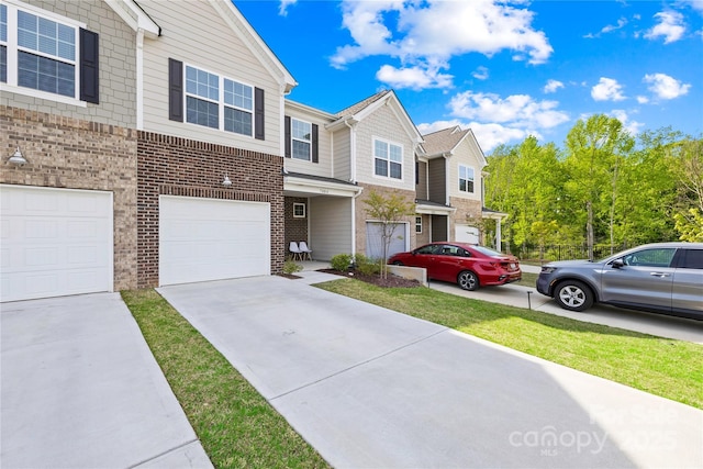 7004 Everly Commons Ln, Tega Cay, SC 29708 - view of property featuring concrete driveway, brick siding, and a garage