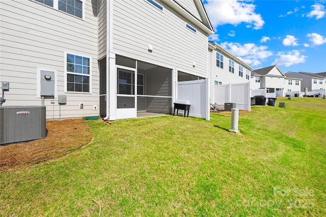 7004 Everly Commons Ln, Tega Cay, SC 29708 - back of house with central AC unit, fence, a residential view, a lawn, and a sunroom
