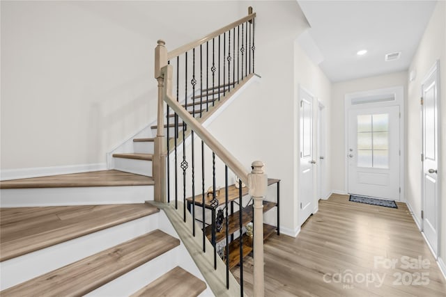 7004 Everly Commons Ln, Tega Cay, SC 29708 - foyer with baseboards, wood finished floors, visible vents, and stairs