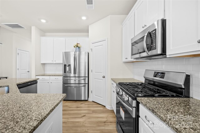 7004 Everly Commons Ln, Tega Cay, SC 29708 - kitchen featuring visible vents, white cabinetry, and stainless steel appliances