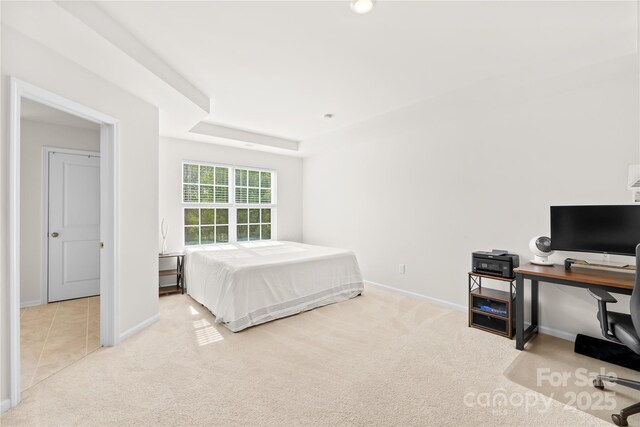 7004 Everly Commons Ln, Tega Cay, SC 29708 - carpeted bedroom with a tray ceiling and baseboards