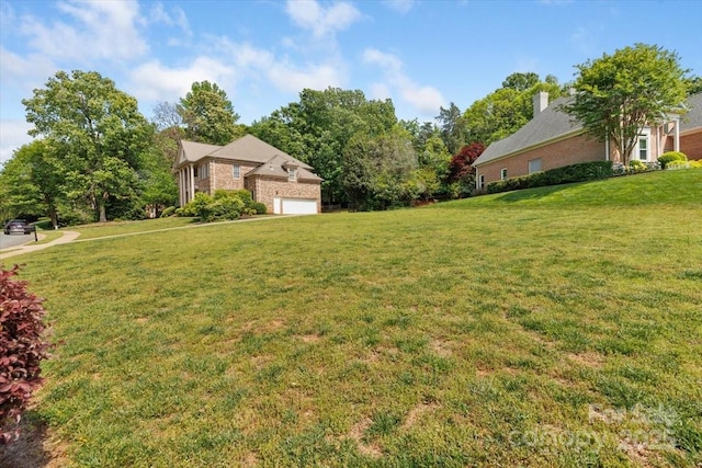 view of yard featuring a garage
