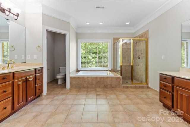bathroom featuring a bath, toilet, ornamental molding, and a stall shower