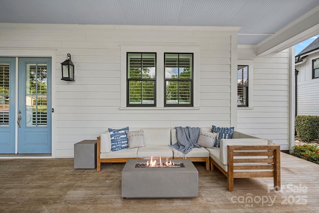 309 Catawba Ave, Davidson, NC 28036 - view of patio / terrace featuring an outdoor living space with a fire pit and french doors