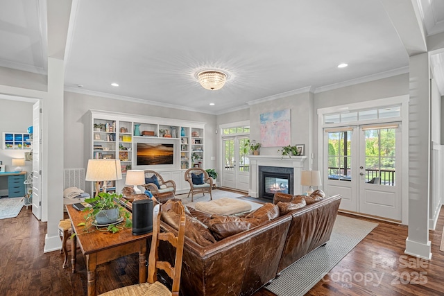309 Catawba Ave, Davidson, NC 28036 - living area featuring french doors, a fireplace with flush hearth, wood finished floors, recessed lighting, and ornamental molding