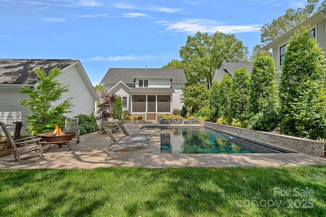309 Catawba Ave, Davidson, NC 28036 - outdoor pool featuring an outdoor fire pit, a sunroom, a patio, and a lawn