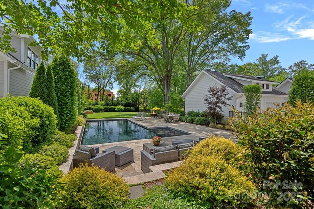 309 Catawba Ave, Davidson, NC 28036 - outdoor pool with an outdoor hangout area and a patio