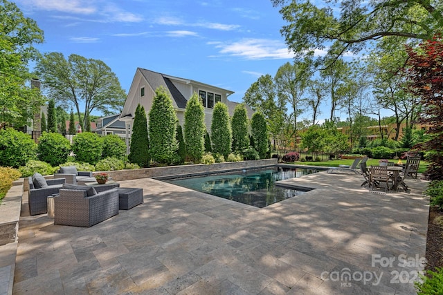 309 Catawba Ave, Davidson, NC 28036 - outdoor pool with a patio area and an outdoor living space