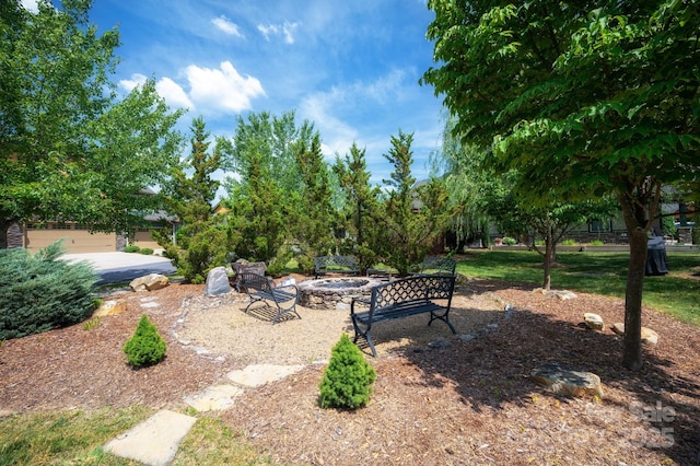 view of yard with a fire pit