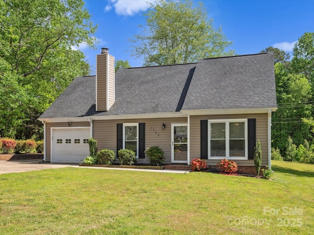 view of front of home with driveway, a chimney, roof with shingles, a front lawn, and an attached garage