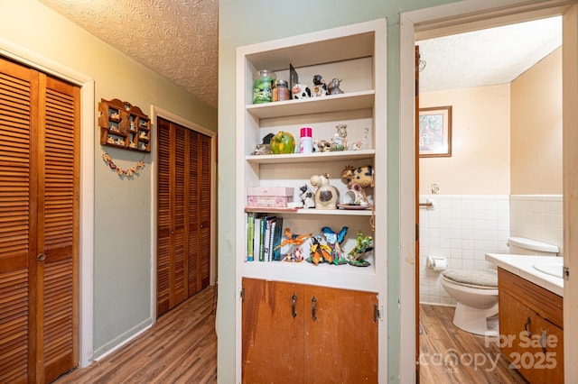 1300 Math Pl, Lenoir, NC 28645 - bathroom with a closet, a textured ceiling, wood finished floors, and toilet