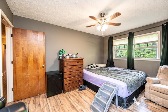 1300 Math Pl, Lenoir, NC 28645 - bedroom with a textured ceiling, a ceiling fan, and wood finished floors