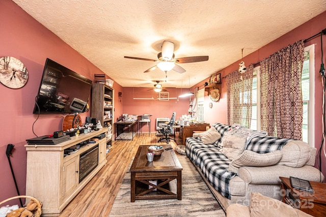 1300 Math Pl, Lenoir, NC 28645 - living area with light wood-style flooring, a ceiling fan, and a textured ceiling