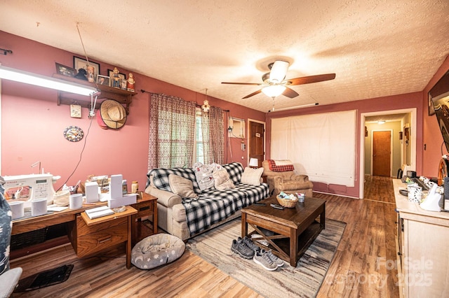 1300 Math Pl, Lenoir, NC 28645 - living room with a textured ceiling, ceiling fan, and wood finished floors