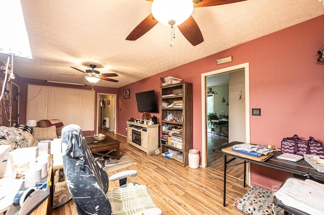 1300 Math Pl, Lenoir, NC 28645 - living room with a ceiling fan, a textured ceiling, and light wood finished floors