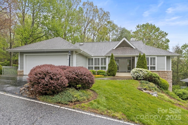 111 Broadmoor Dr, Flat Rock, NC 28731 - ranch-style home with roof with shingles, a chimney, a front yard, and a garage