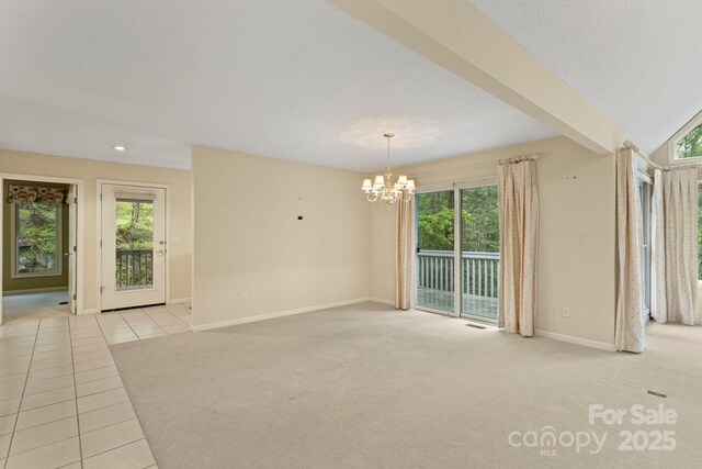 111 Broadmoor Dr, Flat Rock, NC 28731 - carpeted empty room with tile patterned floors, a chandelier, and baseboards