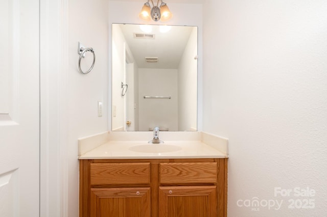 bathroom with visible vents and vanity