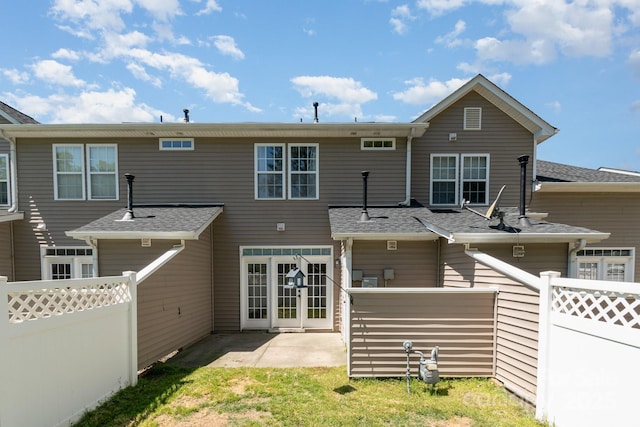 back of property with a patio area and fence