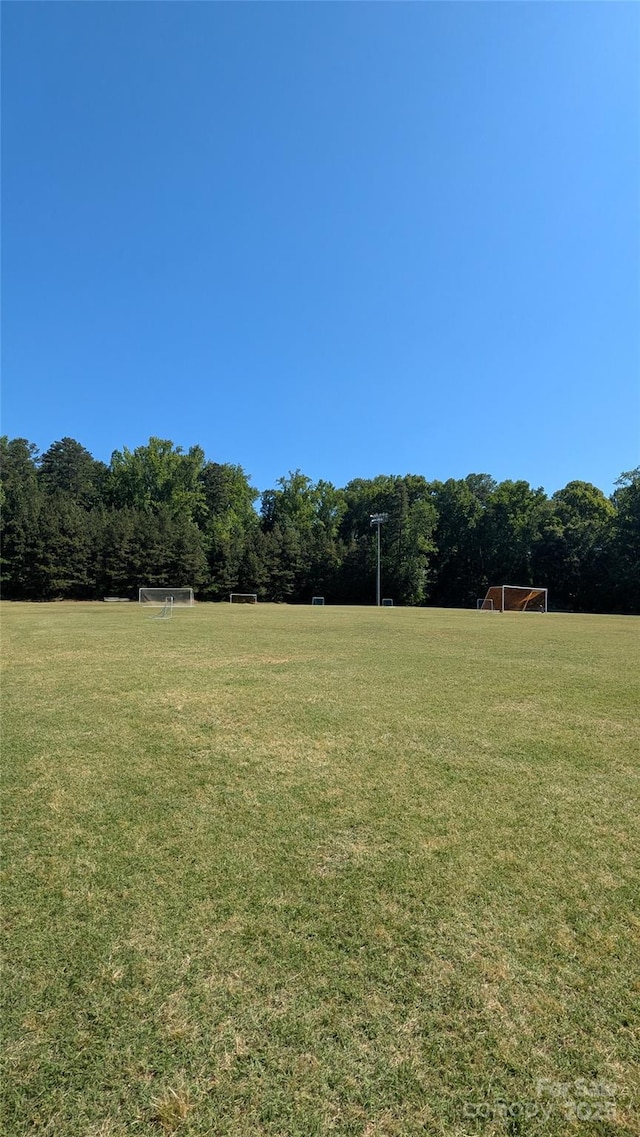 110 Canary Ln Unit 3, Mooresville, NC 28115 - view of yard featuring an area for soccer and a view of trees
