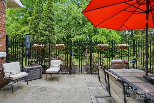 view of patio featuring fence