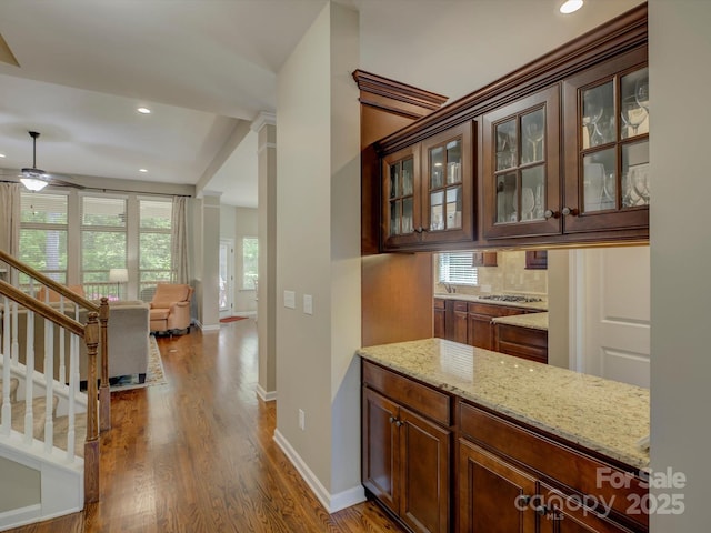 bar featuring decorative backsplash, stairs, wood finished floors, ceiling fan, and recessed lighting