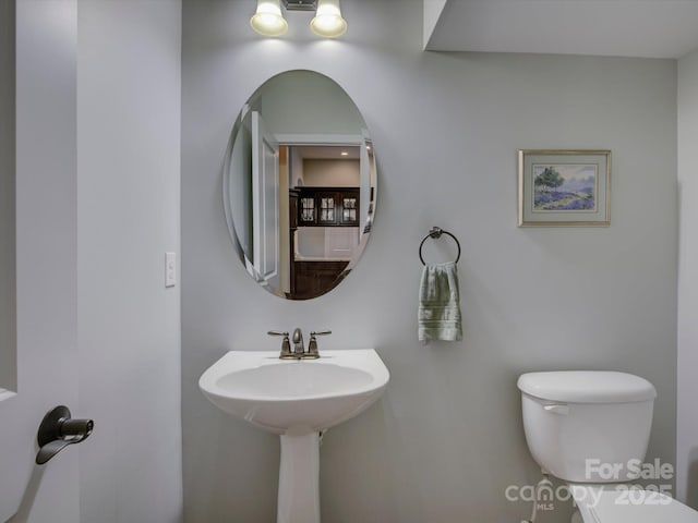 bathroom featuring toilet