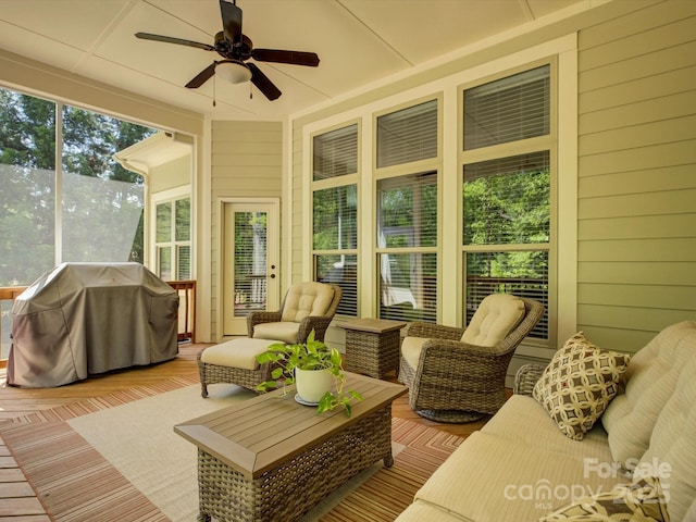 sunroom / solarium with ceiling fan