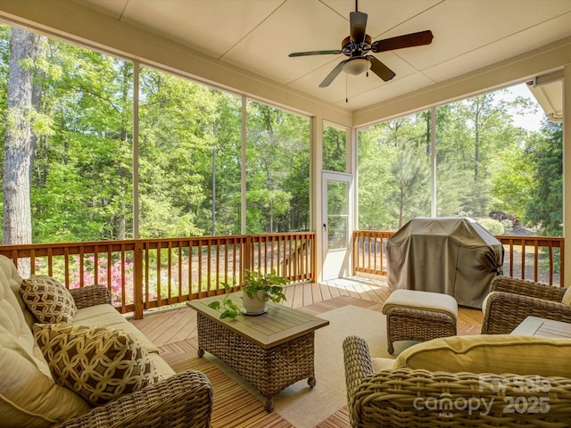 sunroom with ceiling fan and an outdoor hangout area