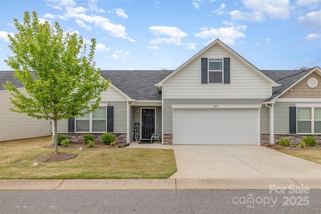 1125 Silvertrace Dr, Salisbury, NC 28144 - view of front of home featuring a garage, a front lawn, stone siding, roof with shingles, and concrete driveway