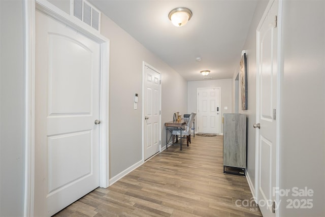 1125 Silvertrace Dr, Salisbury, NC 28144 - corridor with baseboards, visible vents, and light wood-style floors