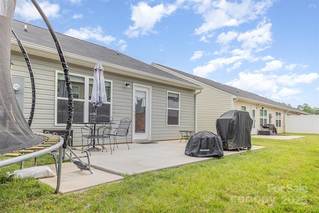 1125 Silvertrace Dr, Salisbury, NC 28144 - back of house with a yard, fence, a trampoline, and a patio area