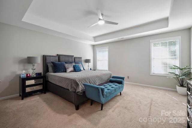 13402 David Jennings Ave, Charlotte, NC 28213 - bedroom with a tray ceiling, light carpet, and baseboards