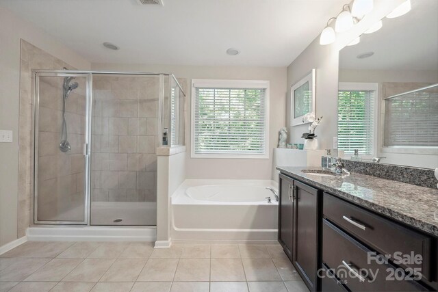 13402 David Jennings Ave, Charlotte, NC 28213 - bathroom with tile patterned floors, plenty of natural light, and a shower stall