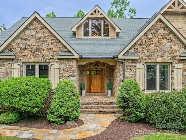 14 Sweet Gum Hl, Fletcher, NC 28732 - view of front facade featuring stone siding and roof with shingles