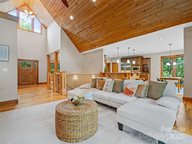 14 Sweet Gum Hl, Fletcher, NC 28732 - living area with light wood-type flooring, plenty of natural light, a chandelier, high vaulted ceiling, and recessed lighting