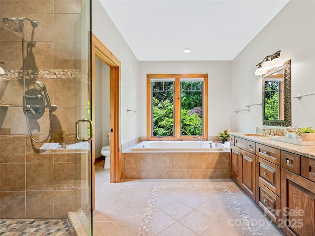 14 Sweet Gum Hl, Fletcher, NC 28732 - bathroom featuring vanity, tile patterned floors, a shower stall, a bath, and toilet