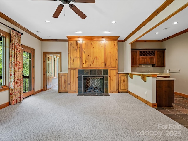 14 Sweet Gum Hl, Fletcher, NC 28732 - unfurnished living room with crown molding, baseboards, recessed lighting, a fireplace, and a ceiling fan
