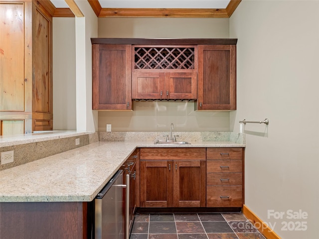 14 Sweet Gum Hl, Fletcher, NC 28732 - kitchen featuring a sink, ornamental molding, light stone counters, baseboards, and brown cabinets