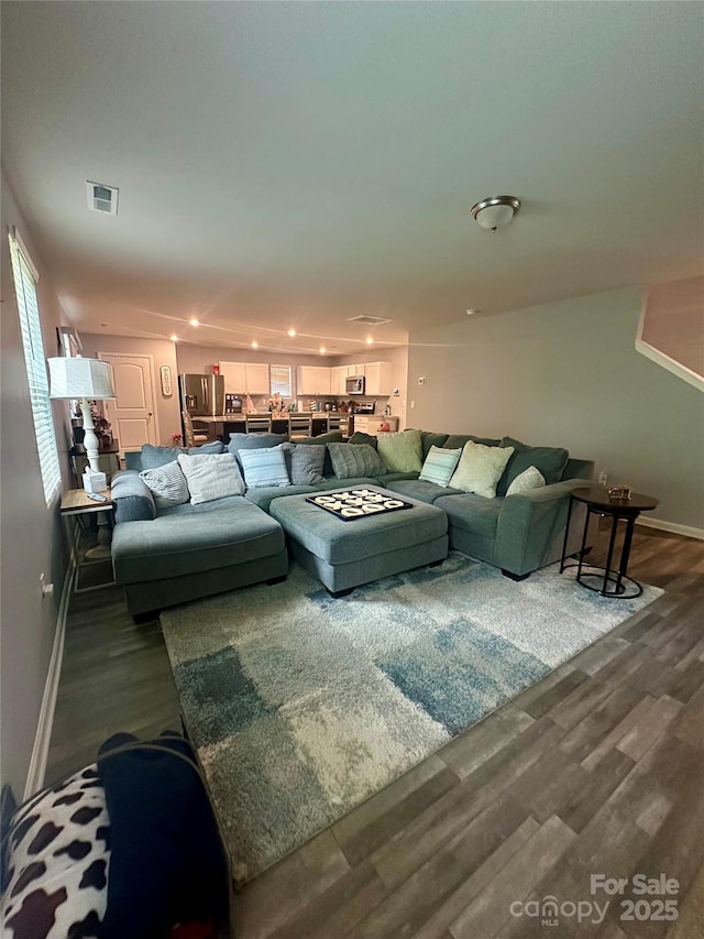 1070 Glenbriar Ct, Woodleaf, NC 27054 - living room featuring baseboards, visible vents, and dark wood-type flooring