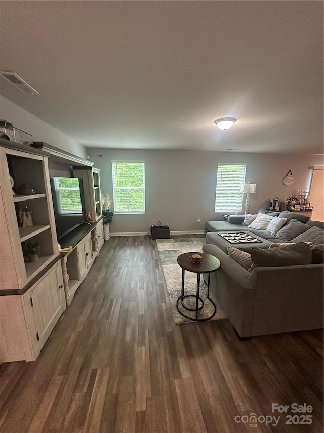 1070 Glenbriar Ct, Woodleaf, NC 27054 - living room with dark wood-style flooring, visible vents, and baseboards