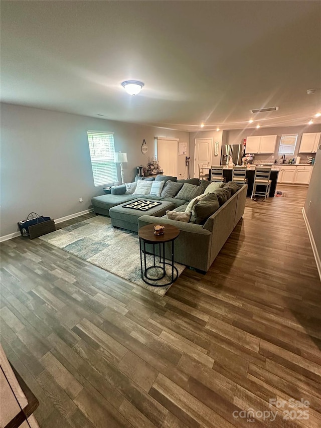 1070 Glenbriar Ct, Woodleaf, NC 27054 - living room with dark wood finished floors and baseboards