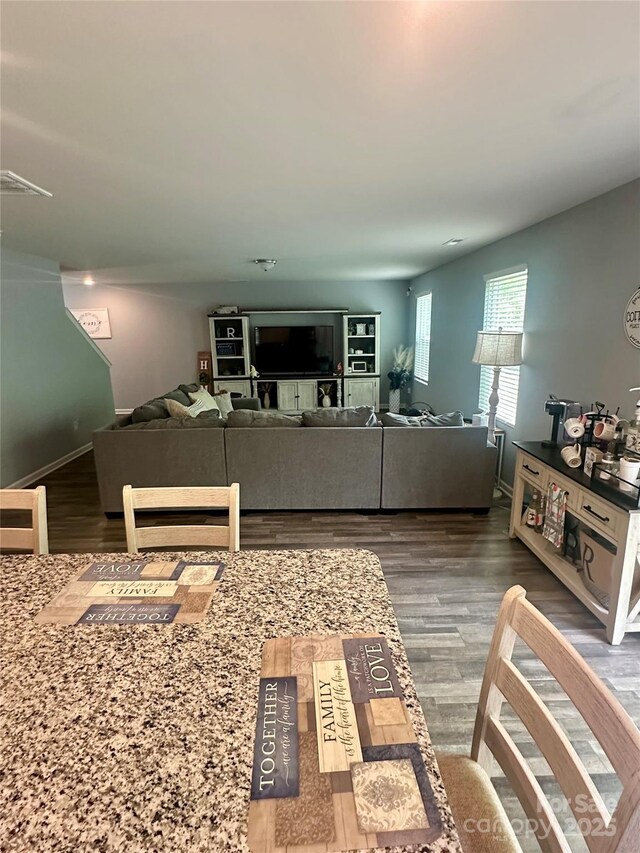 1070 Glenbriar Ct, Woodleaf, NC 27054 - living area with baseboards, visible vents, and wood finished floors