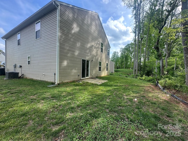 1070 Glenbriar Ct, Woodleaf, NC 27054 - rear view of property with a yard and central air condition unit