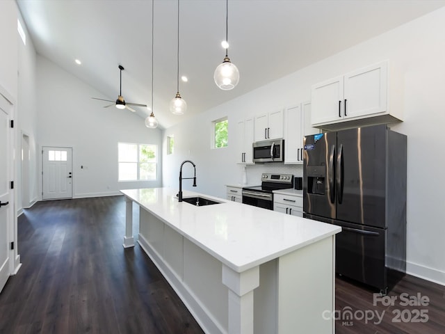3007 W Blvd, Charlotte, NC 28208 - kitchen featuring stainless steel appliances, a sink, white cabinetry, ceiling fan, and dark wood-style floors