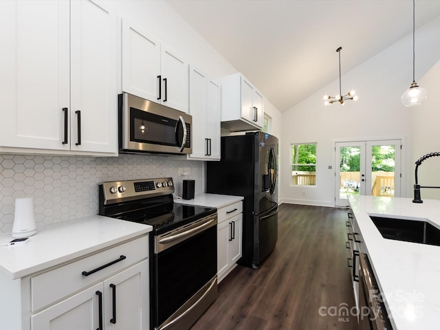3007 W Blvd, Charlotte, NC 28208 - kitchen with appliances with stainless steel finishes, a sink, decorative backsplash, dark wood-type flooring, and light countertops